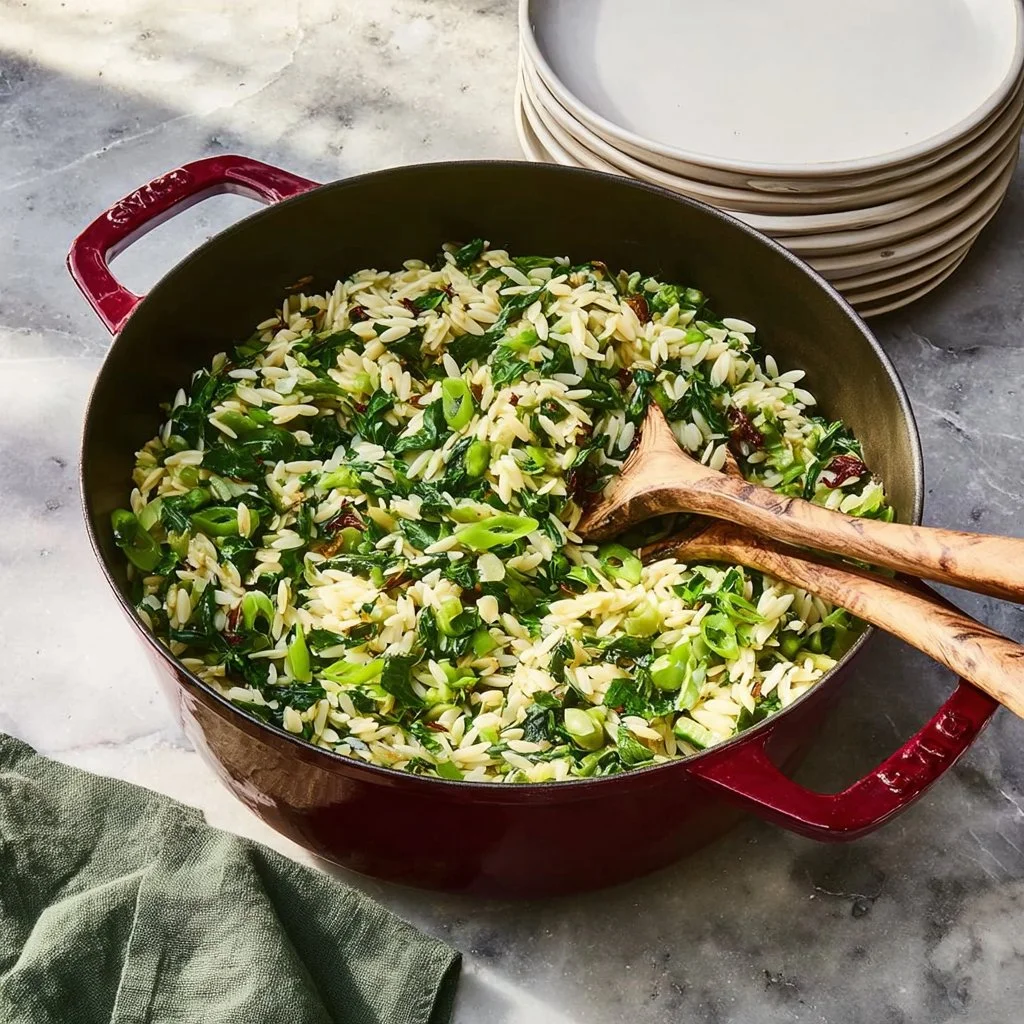 One Pan Spinach and Feta Orzo garnished with fresh herbs and lemon zest