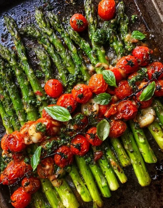 Delicious Parmesan roasted asparagus served on a plate garnished with herbs